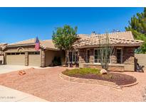 Charming single-story home featuring a desert-landscaped front yard and a two-car garage at 8540 W Wescott Dr, Peoria, AZ 85382
