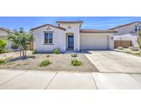 Charming single-story home with desert landscaping and a spacious two-car garage at 12515 W Marguerite Ave, Avondale, AZ 85323