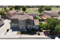 Charming two-story home featuring a well-manicured lawn and desert landscaping at 1410 S Boulder St # A, Gilbert, AZ 85296