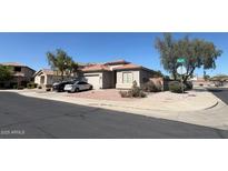 Charming single-story home featuring a two-car garage and low maintenance desert landscaping at 2981 S 257Th Ave, Buckeye, AZ 85326