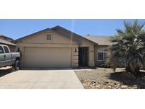 Charming single-story home with a two-car garage and desert landscaping at 4783 E Magnus Dr, San Tan Valley, AZ 85140
