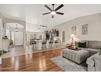 Spacious open-concept living room featuring a large island, and modern decor, ideal for entertaining and relaxation at 6939 S Red Hills Rd, Gold Canyon, AZ 85118