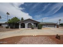 Charming single-story home with well-maintained landscaping and a circular driveway at 7201 N 16Th Dr, Phoenix, AZ 85021