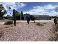 Charming single-story home featuring desert landscaping and a covered front porch at 7201 N 16Th Dr, Phoenix, AZ 85021