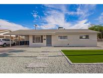 Well-maintained single-story home with low-maintenance desert landscaping at 143 W Ray Rd, Chandler, AZ 85225