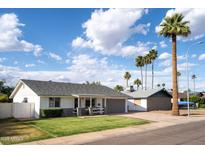 Charming single-Gathering home with well-manicured lawn, palm trees, and welcoming curb appeal at 2418 E Hermosa Dr, Tempe, AZ 85282