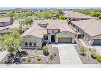 Stunning single-story home showcasing a tile roof, neutral stucco, and a well-manicured desert landscape at 30374 N 124Th Dr, Peoria, AZ 85383