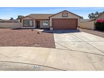 Charming single-story home featuring a two-car garage and low maintenance desert landscaping in the front yard at 3407 N 67Th Ln, Phoenix, AZ 85033
