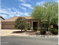 Charming single-Gathering home with desert landscaping, a two-car garage and a terracotta tile roof at 725 S Canfield --, Mesa, AZ 85208