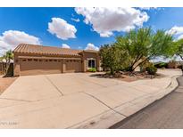 Spacious three-car garage and a well-maintained yard compliment this home's exterior at 725 S Canfield --, Mesa, AZ 85208