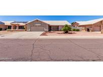 Charming single-story home featuring a low-maintenance yard and a two-car garage at 8500 W Saint John Rd, Peoria, AZ 85382
