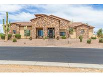 Stunning stone home with tile roof and desert landscaping in a gated community at 2255 N Hillridge --, Mesa, AZ 85207