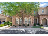 Charming multi-story home with stone facade, manicured landscaping, and a shade tree at 4777 S Fulton Ranch Blvd # 2071, Chandler, AZ 85248