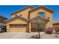 Inviting two-story home with a neutral color palette, low-maintenance landscaping and a cozy front porch at 25218 W Carson Ct, Buckeye, AZ 85326