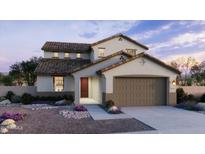 Charming two-story home features a tile roof, neutral stucco exterior, and a two-car garage at 2968 E Mecklenburg Way, San Tan Valley, AZ 85143