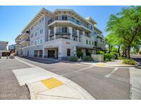 Modern building exterior with a street view and visible architectural details, highlighting its urban appeal at 3801 N Goldwater Blvd # 201, Scottsdale, AZ 85251