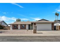 Charming single-story home featuring a neutral color palette, brick accents, and a well-maintained yard at 4720 W Northview Ave, Glendale, AZ 85301