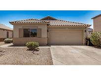 Charming single-story home featuring a tile roof and a two-car garage at 11531 E Persimmon Ave, Mesa, AZ 85212