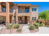 Charming two-story home with a well-manicured yard and a welcoming entrance with desert landscaping at 2821 S Skyline Dr # 157, Mesa, AZ 85212