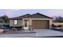 Charming single-story home with a two-car garage, neutral colors, stone accents and desert landscaping at 3013 E Mecklenburg Way, San Tan Valley, AZ 85143
