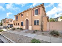 Inviting two-story home featuring a stucco exterior, tiled roof, and desert landscaping at 450 W Mountain Sage Dr, Phoenix, AZ 85045