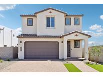 Charming two-story home with a neutral color scheme, two-car garage, and landscaped front yard at 10241 E Ursula Ave, Mesa, AZ 85212