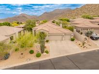 Stunning desert home featuring manicured landscaping, tile roof, and a convenient three-car garage at 11490 E Beck Ln, Scottsdale, AZ 85255