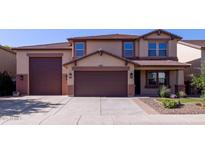 Charming two-story home featuring a three-car garage and low-maintenance landscaping at 12226 W Planada Ln, Sun City, AZ 85373