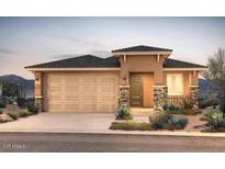 Charming single-story home with desert landscaping, a two-car garage, and stone facade accents at 13573 W Cassia Trl, Peoria, AZ 85383
