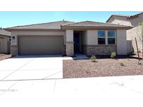 Charming single-story home featuring a two-car garage and low-maintenance desert landscaping at 17505 W Fulton St, Goodyear, AZ 85338