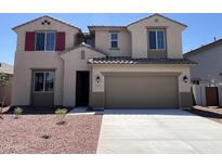 Inviting two-story home featuring a neutral color palette and a spacious two-car garage at 17511 W Fulton St, Goodyear, AZ 85338