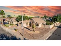 Beautiful single-story home featuring desert landscaping, a two-car garage, and a charming neutral color palette at 2343 E Morelos St, Chandler, AZ 85225