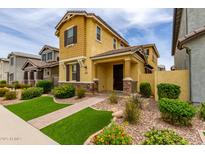 Charming two-story home with well-maintained landscaping and inviting curb appeal at 2499 S Entwistle St, Gilbert, AZ 85295