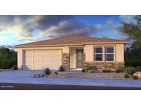 Charming single-story home with stone accents, a two-car garage, and low maintenance desert landscaping at 8836 W Orange Dr, Glendale, AZ 85305