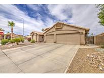 Beige home with a spacious three-car garage and well-maintained landscaping at 1217 S Longmore Ct, Chandler, AZ 85286