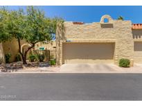 Charming home featuring desert landscaping, a two-car garage, and a textured stucco exterior at 1235 N Sunnyvale -- # 113, Mesa, AZ 85205