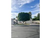 Charming single-story home with well-manicured lawn and mature landscaping in a desirable neighborhood at 2150 E Huron Ct, Gilbert, AZ 85234