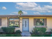Inviting front entryway with a secure screen door, neat landscaping, and sunny curb appeal at 2440 N 22Nd Ave, Phoenix, AZ 85009