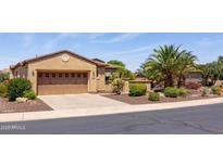 Lovely single-story home featuring a two-car garage, desert landscaping, and a well-maintained yard at 27380 N 128Th Ln, Peoria, AZ 85383