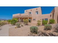 Charming two-story home with desert landscaping and inviting front walkway. Located in a sunny, desirable area at 38065 N Cave Creek Rd # 52, Cave Creek, AZ 85331