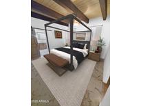 This primary bedroom offers a stylish canopy bed and wood beam ceiling at 9607 E Mckellips Rd, Mesa, AZ 85207