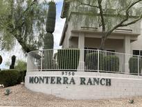 Monterra Ranch community sign with desert landscaping and partial view of a building at 9750 N Monterey Dr # 71, Fountain Hills, AZ 85268