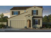 Charming two-story home with a tile roof, tan stucco, a two-car garage, and complementary brown shutters at 17620 W Georgia Ave, Litchfield Park, AZ 85340