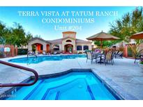 Community pool and spa for Terra Vista at Tatum Ranch Condominiums offers shaded tables and lounge chairs at 29606 N Tatum Blvd # 204, Cave Creek, AZ 85331