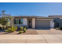 Charming single-story home featuring a well-manicured lawn and a two-car garage at 4925 S Turbine --, Mesa, AZ 85212