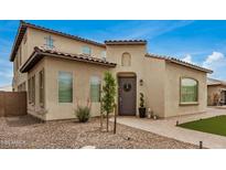 Attractive two-story home showcasing mature landscaping, a tiled roof, and an inviting entryway at 9508 W Jj Ranch Rd, Peoria, AZ 85383