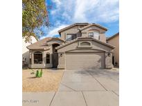 Charming two-story home featuring a desert landscape, a two-car garage, and a neutral color scheme at 20929 N 37Th Way, Phoenix, AZ 85050