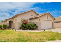 Charming single-story home with desert landscaping and a well-maintained front yard at 20977 N 84Th Ln, Peoria, AZ 85382