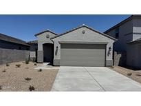 Charming single-story home featuring desert landscaping and a neutral color palette at 22895 N 183Rd Dr, Surprise, AZ 85387