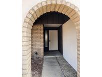 Inviting arched entryway with brick and stucco accents, leading to a white front door at 3102 N Woodburne Dr, Chandler, AZ 85224